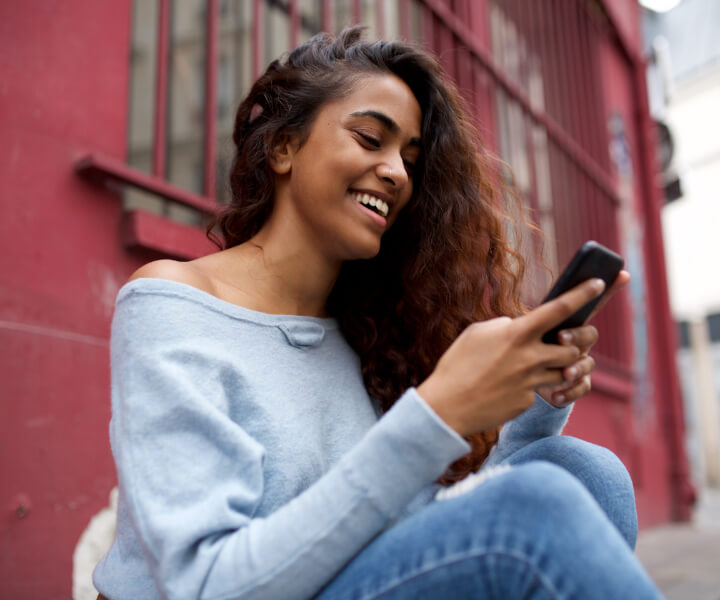 girl smiling with phone